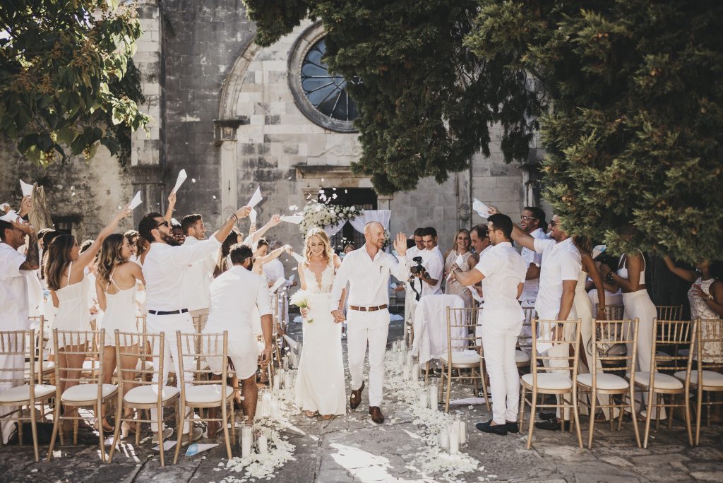 newlyweds after getting married in the garden of the St. Mark Church Hvar