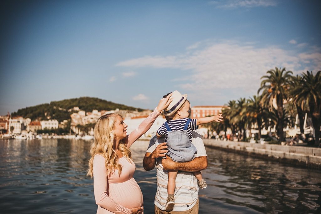 Family playing and posing for photographer