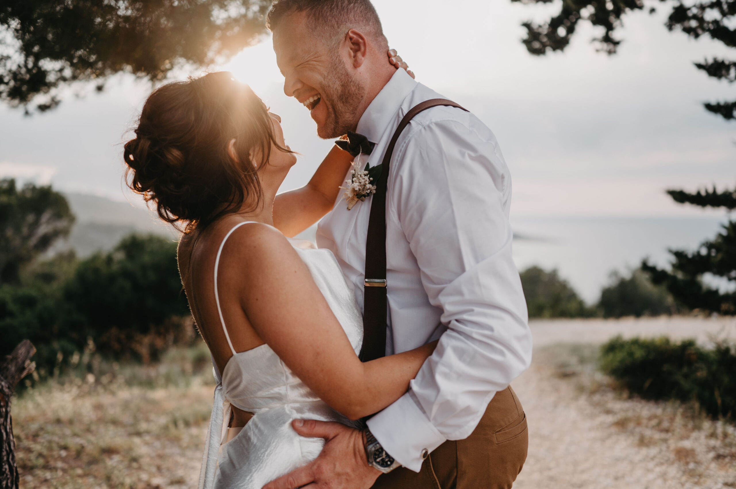 Groom is smiling while watching Bride